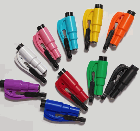 Compact window breaker and seatbelt cutter tool with ergonomic grip and bright color for emergency vehicle escape