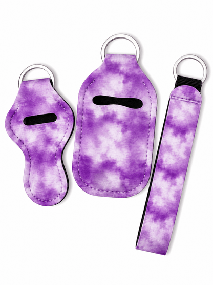 Matching gloss case, sanitizer holder, and wristlet keychain set with stylish prints and free bottle