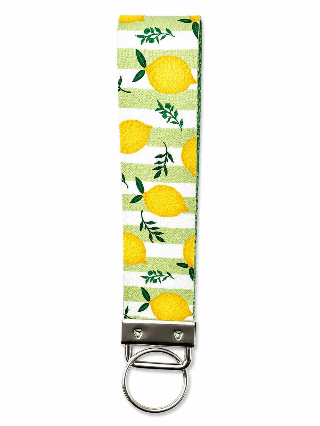 Printed wrist strap keychain with colorful playful patterns and metal clasp on white fabric