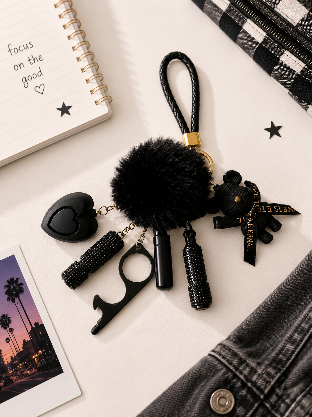 Confidence Club Safety Kit featuring black silicone, plastic, and metal safety tools with pom-pom and wristlet keychain