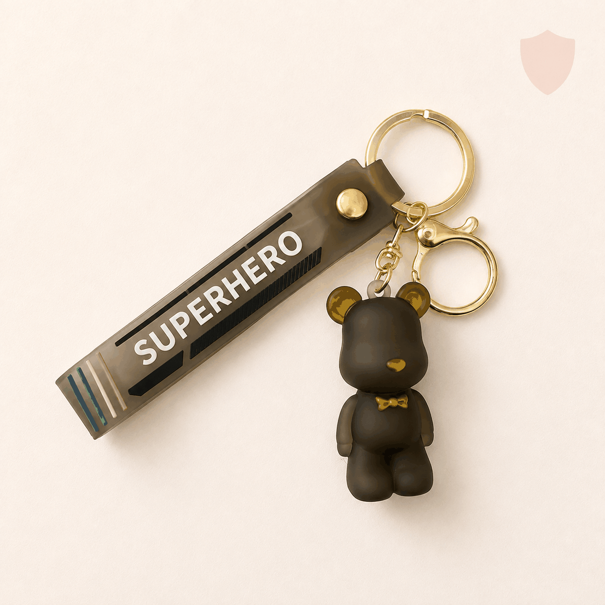 Matte rubber S&S superhero bear keychain with gold-tone clasp and strap